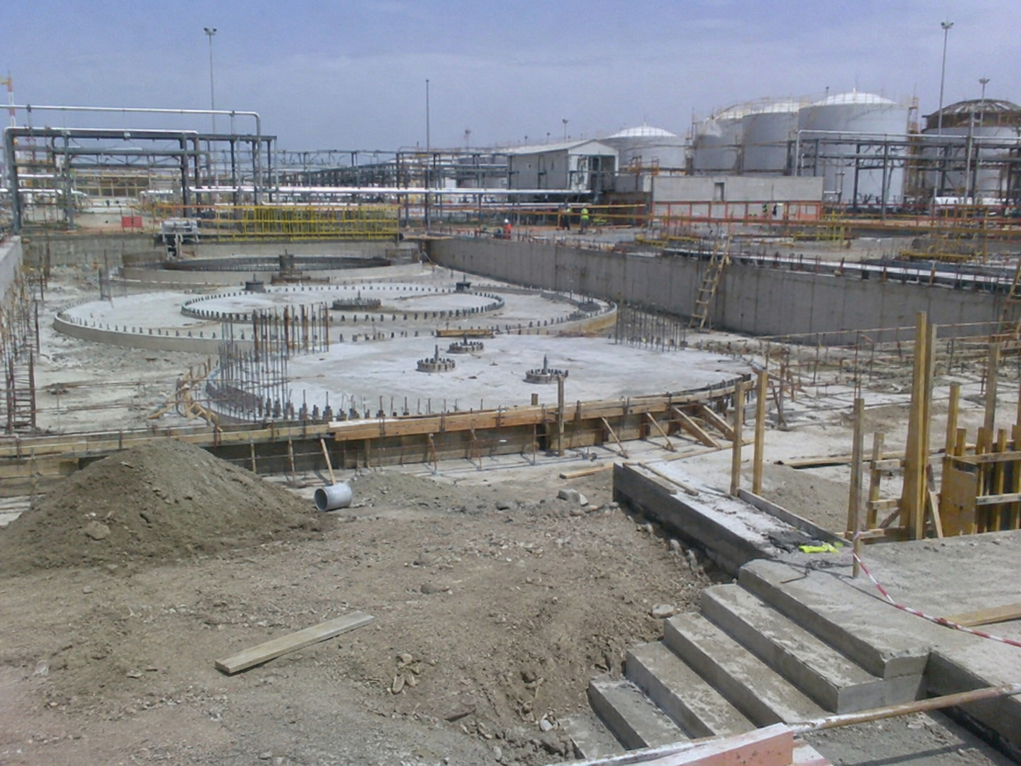 Oil infrastructure civil works with pipe racks and storage tanks